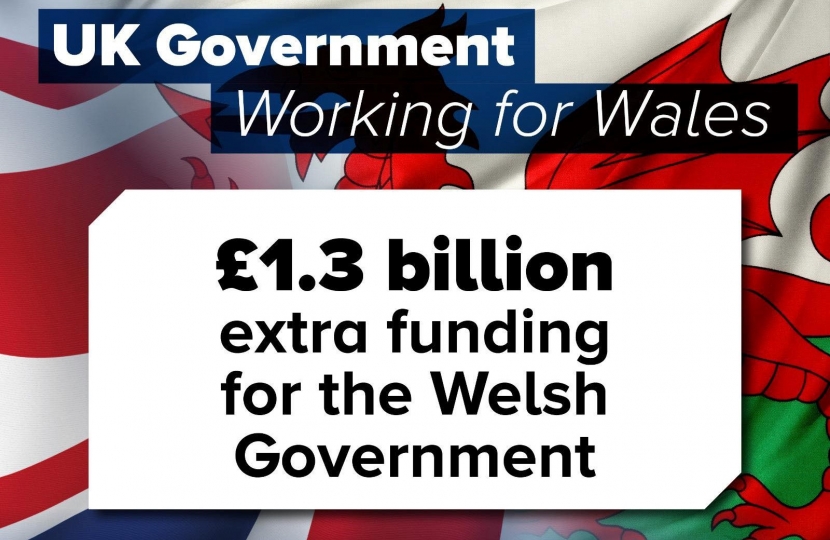 Image of the UK Flag and Welsh Flag with the text - 'UK Government Working for Wales: £1.3 billion extra funding for the Welsh Government'